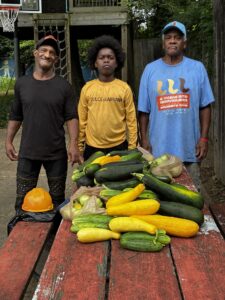 Seniors and neighborhood youth with bountiful harvest at Jacob’s Ladder.